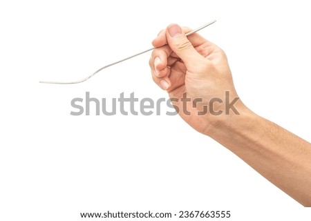 isolated of a man's hand holding a silver steel fork to pick food.