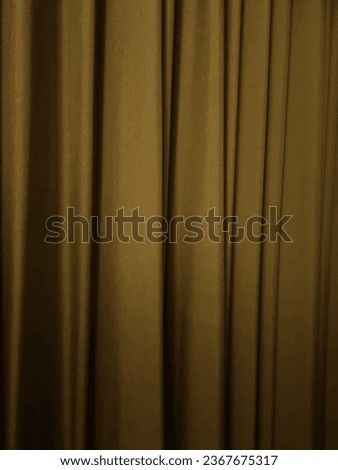 Curtain with gold colored pictured in the evening
