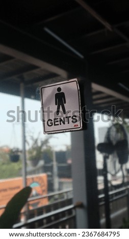 sign gents for the public toilet