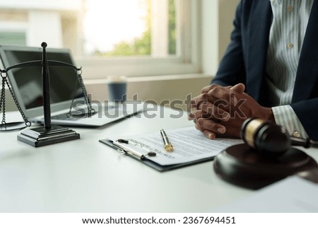 Attorney reading law code, studying constitution to protect human rights closeup, Male lawyer or judge working with Law books, gavel