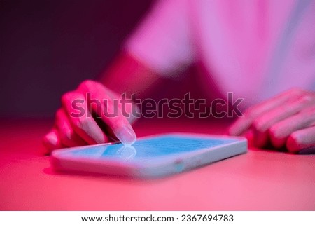 Use of mobile phone under pink light