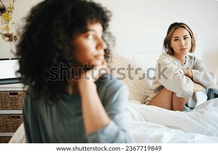 Lgbtq, woman and depressed for couple fight in bedroom of home with conflict, crisis or problem in relationship. Lesbian, partner and girl on bed with stress, anxiety and sad for argument and divorce Royalty-Free Stock Photo #2367719849