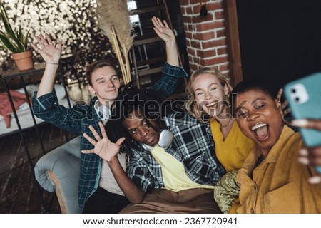 Cheerful group of diverse best friends taking selfie. Young people international students have fun together, party, celebrate. African American, Caucasian multi cultural college university community
