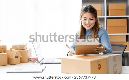 Startup small business entrepreneur or freelance Asian woman holding parcel box, Young success Asian woman with her online marketing packaging box and delivery	 Royalty-Free Stock Photo #2367737973