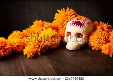 Sugar skull with Cempasuchil flowers or Marigold. Decoration traditionally used in altars for the celebration of the day of the dead in Mexico Royalty-Free Stock Photo #2367750453