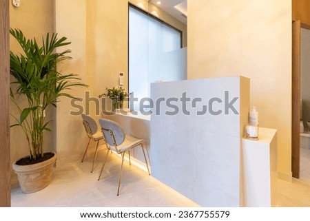 Interior design of the entrance of a luxury clinic with plants and chairs Royalty-Free Stock Photo #2367755579