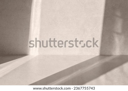 Sustainable minimal background for product presentation placement, empty beige stone concrete table, desk or floor and wall with abstract light shadow. Brand interior design template.