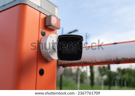 License plate reader, automatic number recognition, digital surveillance camera, boom barrier gate. Smart parking lot entrance pass automation. Vehicle access control. Car park identification system. Royalty-Free Stock Photo #2367761709
