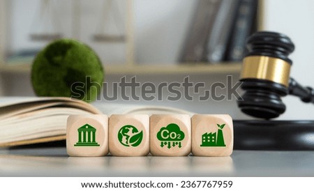 Law international environmental concept.Wooden cubes with a decarbonization icon and green icon.Law for environmental regulation.Sustainable environment concept. Royalty-Free Stock Photo #2367767959