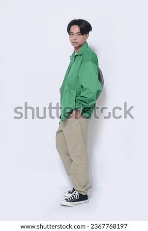 Full body Portrait of 
Young Man, student Posing Over White Background
