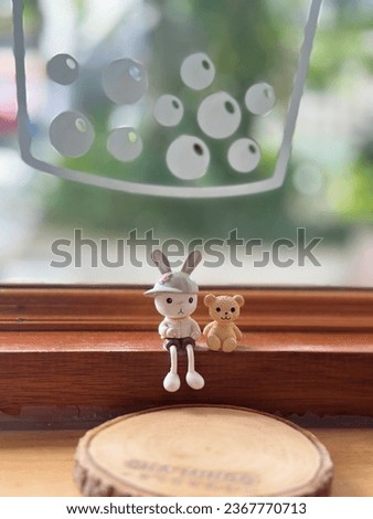 Model a rabbit cartoon and a picture of a cafe in Thailand.