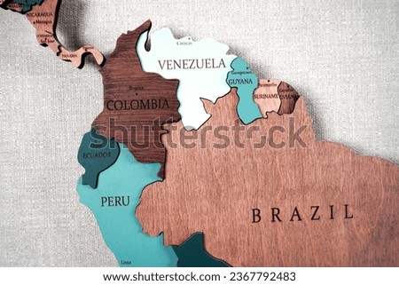 Central America continent on a wooden world map on a wall, Brazil, Venezuela, Colombia, Peru,, Guyana, Suriname, Gviana, Ecuador, Panama, Costarica                       Royalty-Free Stock Photo #2367792483