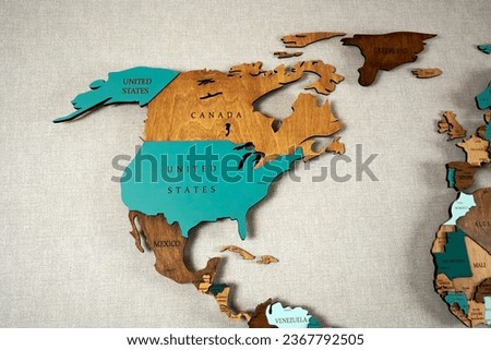 North America continent on a wooden world map on a wall. USA, Canada, Mexico                  