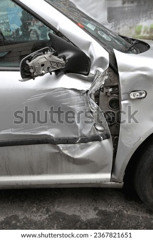 Crushed Door Damaged Silver Car Traffic Accident Insurance Royalty-Free Stock Photo #2367821651