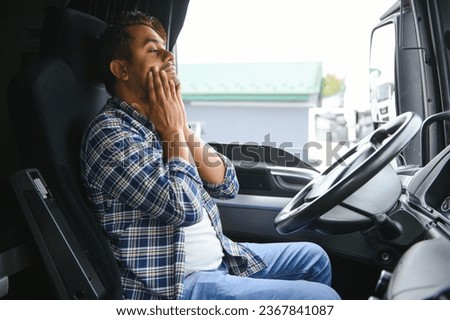 Portrait of tired indian truck driver feeling sleepy and sick Royalty-Free Stock Photo #2367841087