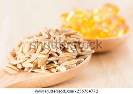 Rice bran oil is produced from rice bran oil. Which is extracted from rice bran.   Royalty-Free Stock Photo #236784772