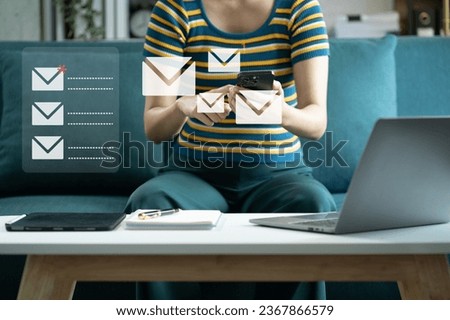 Email notification concept, Women use smartphone and laptop receive message alert in the mailbox.