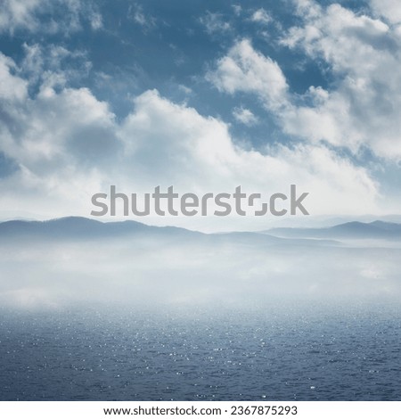 blue sky and clouds above sea water