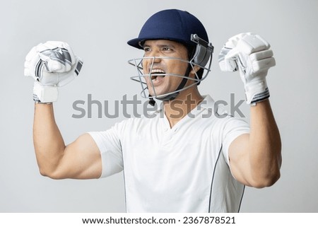 Man In cricket dress with helmet screaming in joy and anger, Cricketer world cup concept