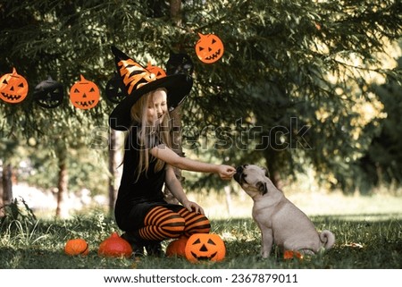 Halloween girl and dog,Girl dressed as a witch, Halloween, pumpkin, pug