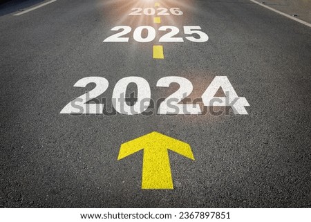 2024 to 2026 written on the road background with yellow arrow. Business planning recovery concept and new year beginning success idea Royalty-Free Stock Photo #2367897851