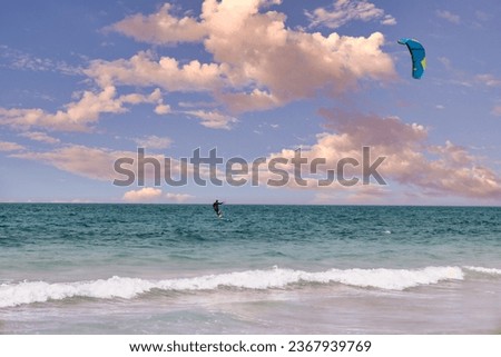 kite surfing in the blue sea with a beautiful backdrop. High-quality photo
