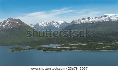 Aerial view of Port Alsworth, Alaska within Lake Clark National Park and Preserve. Private Port Alsworth Airport, public Wilder Natwick Airport, Tanalian Mountain, Chig­mit Mountains, Hardenburg bay. Royalty-Free Stock Photo #2367943057