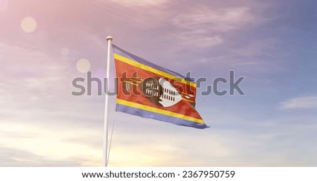 Eswatini national flag waving in beautiful sky.