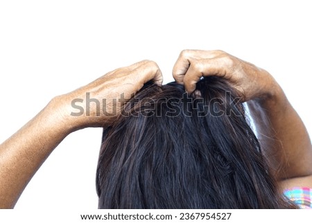 Woman use hands to scratch her itcy hair on head, isolated on white background. Concept, Hair health problems. Dandruff, fungus on scalp, allergic to shampoo or louse.                              