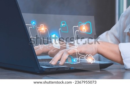 Businesswoman hands using Laptop on office desk with Document Management System (DMS) Virtual screen with AI technology to manage files efficiently, conveniently, quickly and securely.