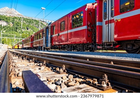 Red train of Bernina in the Swiss alps Royalty-Free Stock Photo #2367979871