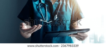 Doctor working with laptop computer in medical workspace office. doctor working on laptop computer in modern clinics office. search medical information. banner copy space Royalty-Free Stock Photo #2367983339