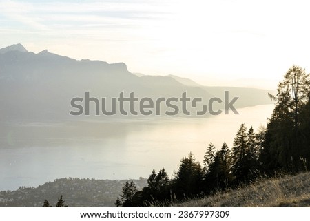 Peak to Lake Panorama: Nature's canvas displays the sweeping vista from the mountain peaks to the tranquil waters Royalty-Free Stock Photo #2367997309