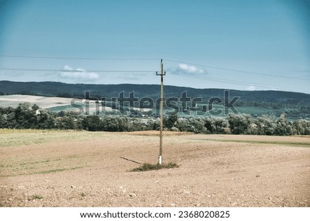 Picture of an electricity pole at the countryside in austria
