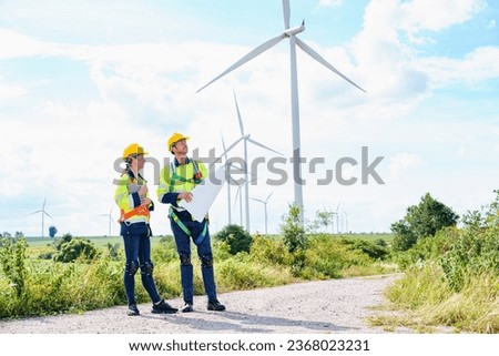 Architectural Engineering working and maintenance with wind turbine blueprint pictures of wind turbines at windmill field farm. Alternative renewable energy for better living concept. 