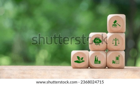 Wooden block with environmental law icons. Concept of international law environmental protection, environmental impact assessment, Eco friendly law, eco balance, business corporate and industry. Royalty-Free Stock Photo #2368024715