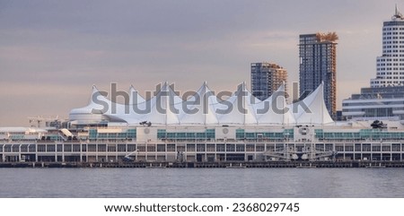 Canada Place in Downtown Vancouver, British Columbia, Canada. Cityscape Panorama Background. Sunset Sky