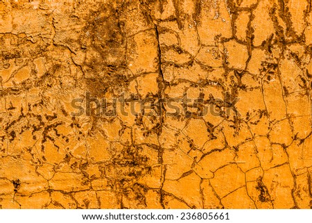 Old concrete wall orange background.
