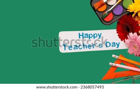 World Teacher's Day TexTeacher's day concept School Stationary Top View .green background