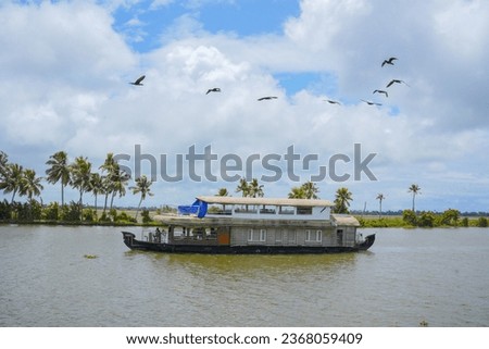 alleppey houseboat tourism with blue sky
