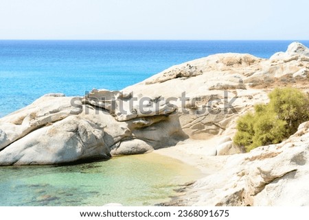 small beach formed by rocks in Naxos