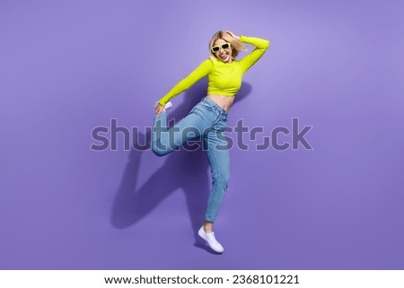 Full length photo of overjoyed glad girl wear trendy outfit dancing night club friday chill vibe isolated on purple color background