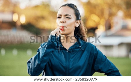 Coach, sports and woman blowing whistle on field for training, planning and challenge for games. Coaching, manager and personal trainer outdoor for exercise, workout schedule and fitness routine Royalty-Free Stock Photo #2368120979