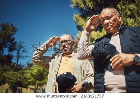 Salute, war veteran and men at cemetery to pay respect to fallen soldier outdoor at memorial service. Military, senior friends or salutation of army people for grief, support or empathy in retirement Royalty-Free Stock Photo #2368121757