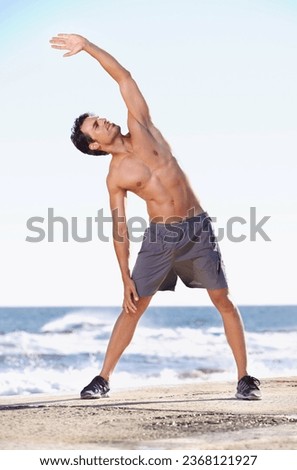 Fitness, man and stretching body on beach getting ready for exercise, workout or training in nature. Fit, active or muscular male exercising in warm up stretch for healthy cardio or wellness by ocean