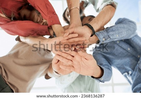 People fold their hands on each other, symbolizing their unity and support.