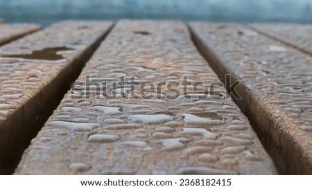 Water drops on a wooden surface