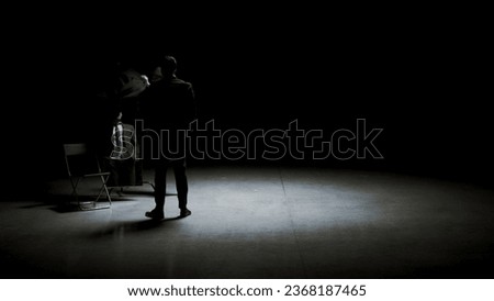 Theatrical production. Stock footage. A dark room with various accessories for the theater and actors.