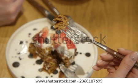 Close-up of couple on date with delicious dishes. Stock footage. Delicious dishes and desserts in restaurant for evening dinner. Couple have desserts at restaurant in evening