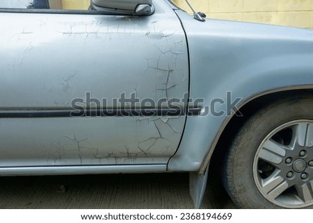 Cracks paint on the car,Crack on bumper of white car